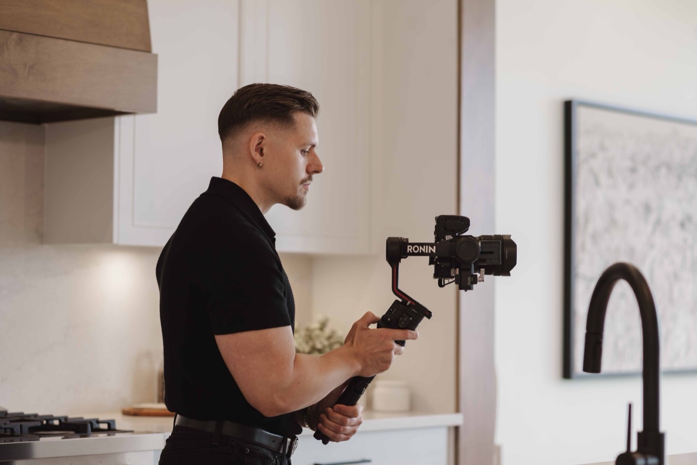 Cinematographer filming a property with a gimbal